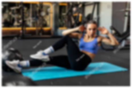 stock-photo-active-young-woman-doing-bicycle-crunch-sit-up-exercise-on-mat-sporty-lady-in-activewear-training-2454586901 1