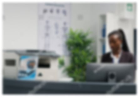 stock-photo-female-receptionist-answering-landline-phone-call-at-lobby-counter-working-in-hospital-to-give-2299960267 1